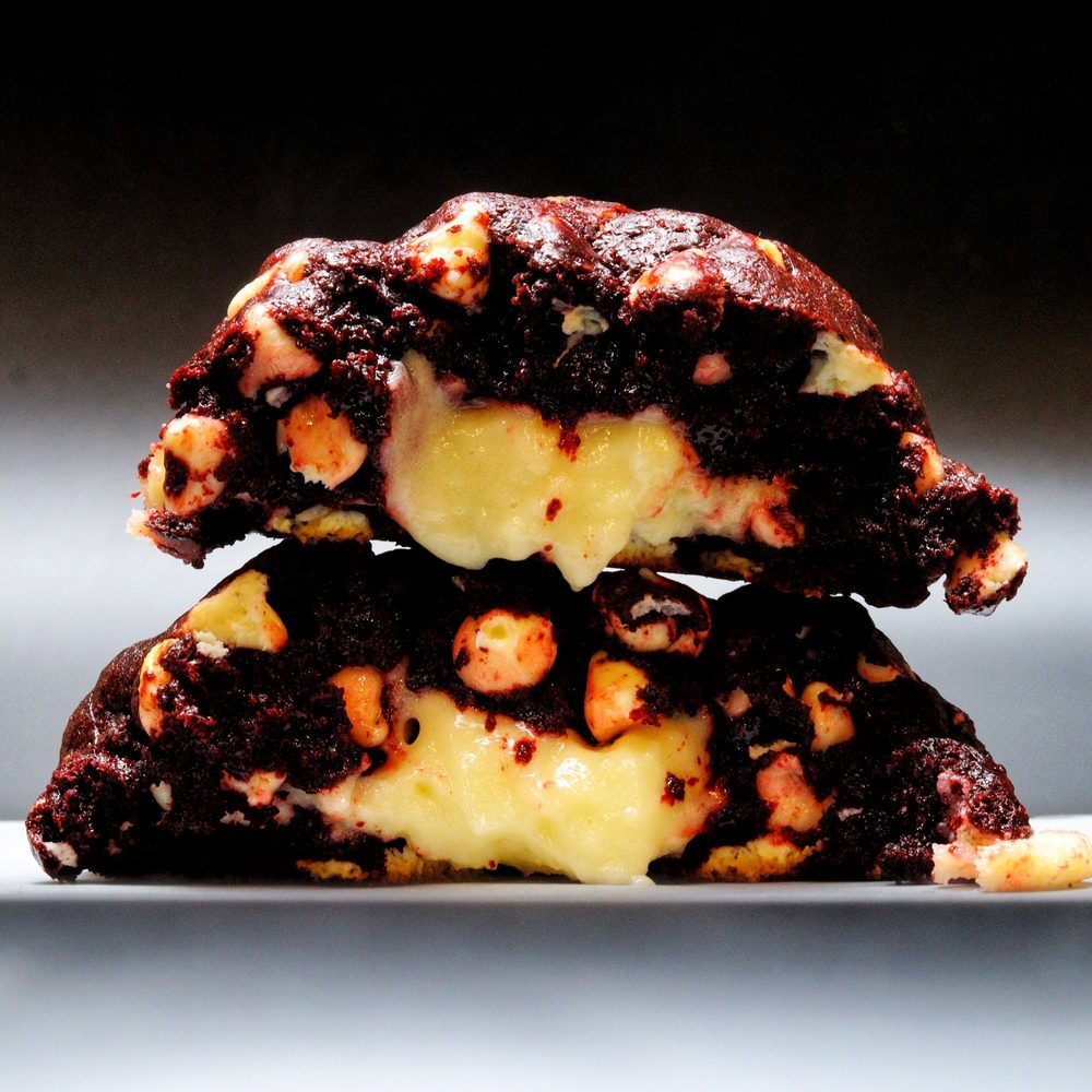 Second Thoughts red velvet cookie pulled apart, showing its cream cheese center